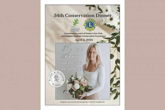A photo of 2024 Conservation Dinner programme cover with feature artist holding flowers.
