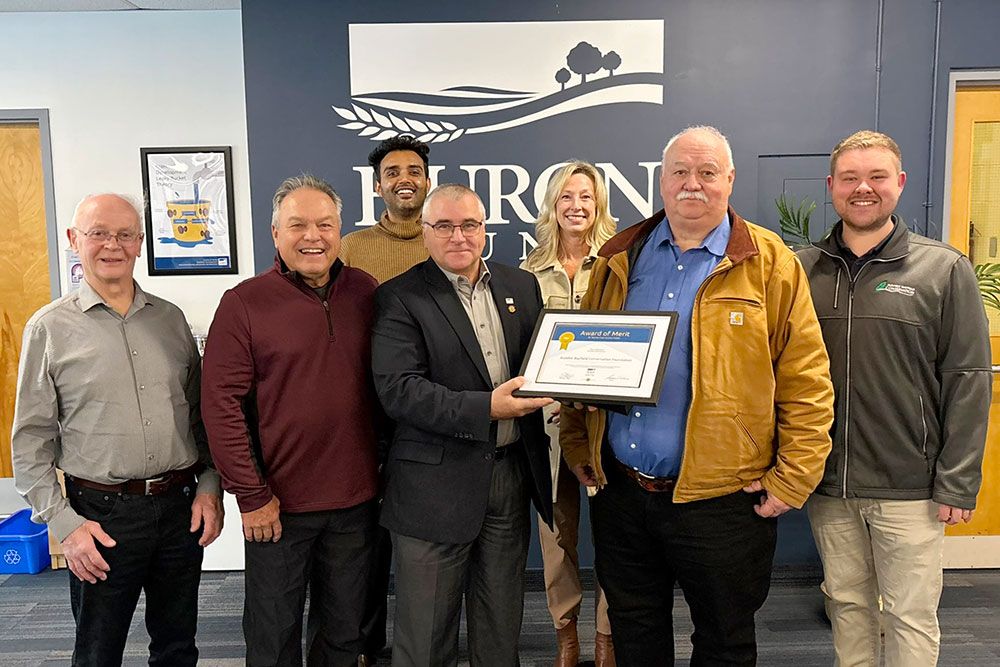 Jamie Heffer, County of Huron Warden, presents award to Conservation Foundation.