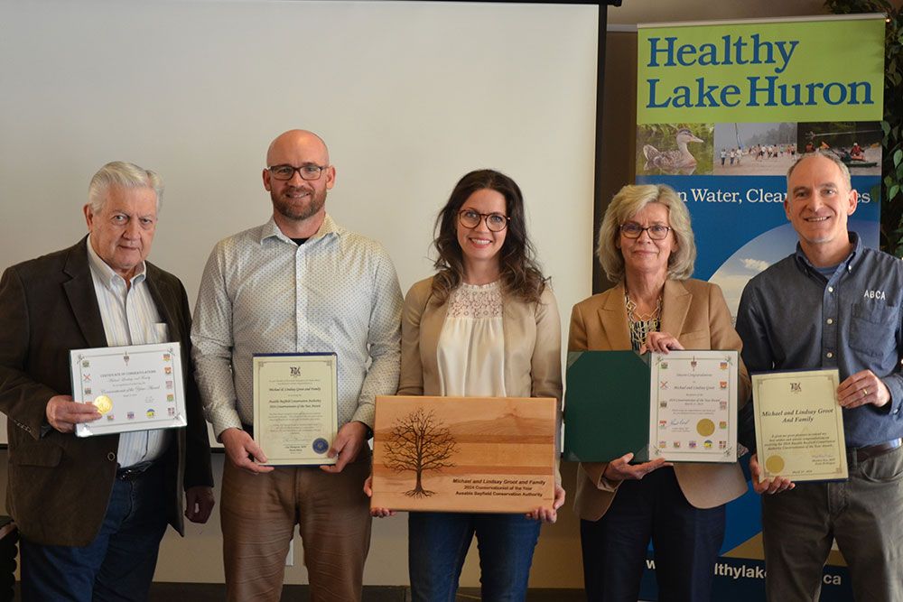 Michael and Lindsay Groot and family were recognized with conservation award and scrolls from MPs and MPPs.