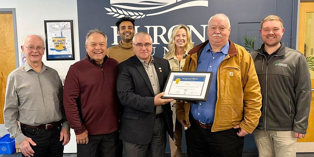 Jamie Heffer, County of Huron Warden, presents award to Conservation Foundation.