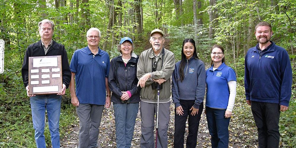Presentation, at TTLT's Joany's Woods property, of Decade Award.