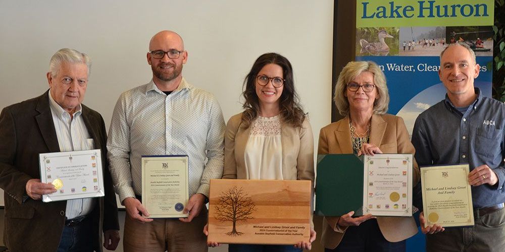 Michael and Lindsay Groot and family were recognized with conservation award and scrolls from MPs and MPPs.